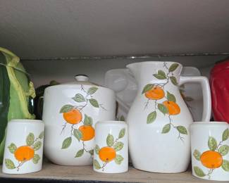 Mid-Century Modern orange pitcher cup canister set