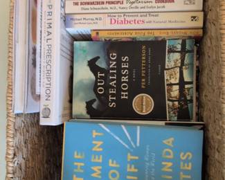 Assorted Books in Wicker Basket