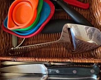 Assorted Kitchen Utensils including Pampered Chef Mandoline Slicer, Steak Knives, and Cheese Slicer