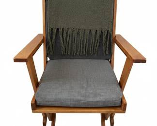 MidCentury Modern Wooden Armchair with Grey Upholstery and Fringed Throw Blanket