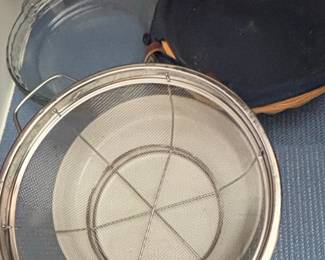 Assorted Kitchenware Glass Bakeware, Metal Strainer, and Enamelware Dish