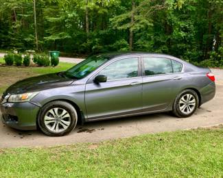 2014 Honda Accord. 214,000 miles, has some cosmetic damage but does run.