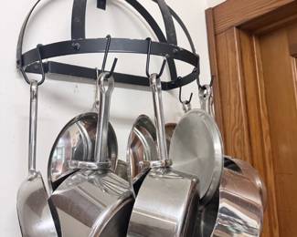 Wrought Iron SemiCircular WallMounted Pot Rack with Assorted Stainless Steel Cookware