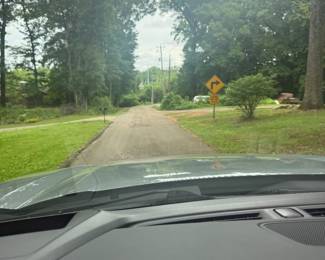 You'll drive past the front of the house on Roselyn Rd. Take a left onto School Road SE. There will be directional signs.