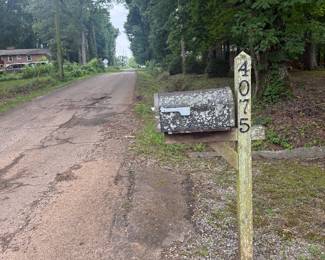 You'll drive past the front of the house on Roselyn Rd. Take a left onto School Road SE. There will be directional signs. 