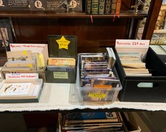 Non Local, and Thomas Kinkade postcards.