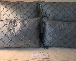 White Matelasse Quilt With Raised Floral Pattern And Decorative Throw Pillows