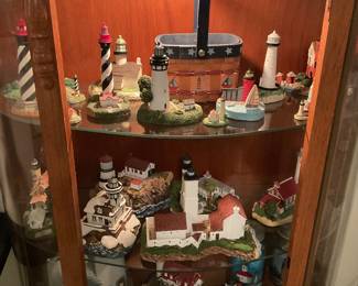  Harbor Lights lighthouse collection in lighted curio cabinet