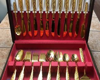 Beautiful gold tone flatware set, never used