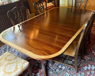 Antique Mahagony and Satin Wood Banded Double Pedestal Dining Table having 4 11" Deep Leaves. Table w/o Leaves is 6' L x 4' W.