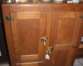 This is an early ice box which used actual ice for conservation of food. 