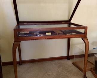 glass and wood curio table