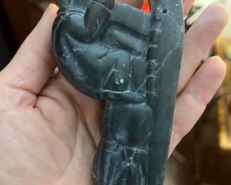 inuit hand carved figurine of hunter on a sled with dogs