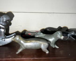inuit hand carved figurine of hunter on a sled with dogs