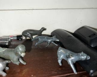 inuit hand carved figurine of hunter on a sled with dogs