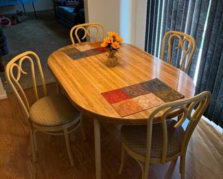 Table with leaf and  4 matching chairs.