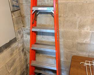 6’ folding fiberglass ladder.