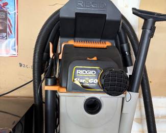 Rigid, wet, dry vac backpack