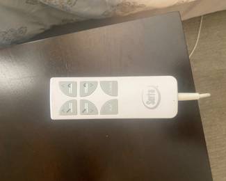 One of 2 Serta remote controls for dual mattresses