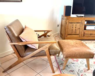 a Leather Mid Century Modern style Chair and Ottoman in Danish Style