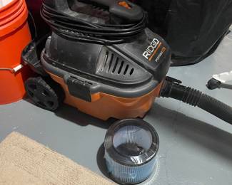 RIDGID portable wet/dry shop vacuum with hose and reusable filter,
