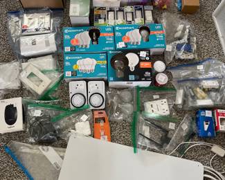 Large assortment of new and like-new electrical supplies, LED light bulbs, switches, outlets, timers, smart home accessories, wall heater, hardware, and miscellaneous home improvement items, everything priced to sell!