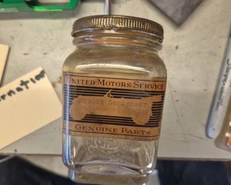 Antique National Motor parts storage jars