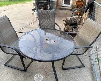 Glass outdoor table with 4 chairs