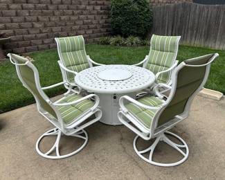 Tropitone firepit table and 4 metal swivel rocking chairs