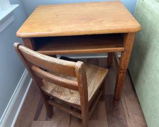 One of two vintage student desks and chairs