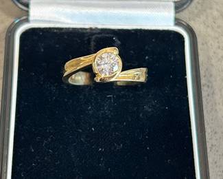 Lady’s 18k gold ring and .51 carat diamond