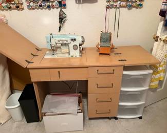 White Sewing machine in cabinet