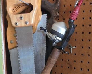 Vintage Hand Saw and Zebco Spincast Fishing Reel Collection