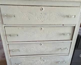 Vintage Painted Four-Drawer Chest with Embossed Scrollwork and Glass Pulls