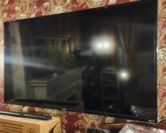 48" TCL Roku TV with wall mount and table top stand