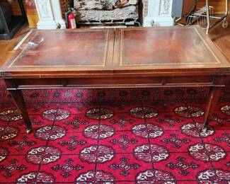 Closed leather top hors d' ouvres coffee table 