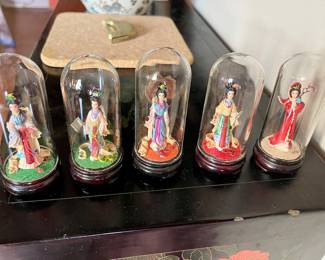 Miniature Geishas under glass