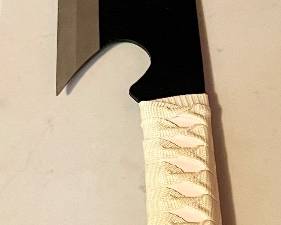 Bleach anime sword. Approximately 4’ long. Small bend at tip.