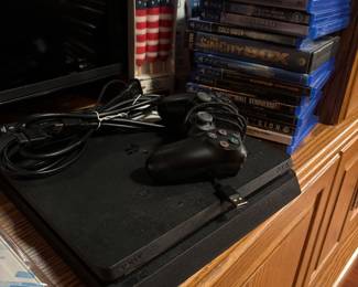 Play Station 4 + Play Station 4 Games