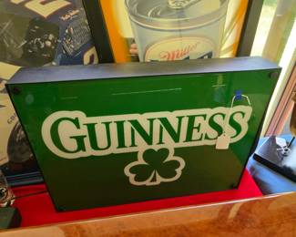 Lighted Guinness beer sign.