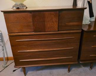 mid-century modern tall dresser by United Furniture signature sculpted drawer design and tapered legs