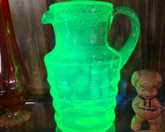 Vaseline etched glass pitcher with lid.