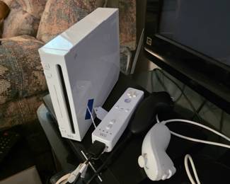 Wii system, plays for a while then has a disk reading error, could need cleaning.