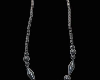 Hematite Necklace with Central Ring Accents and Faceted Beads