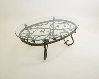 Wrought Iron Oval Coffee Table with Glass Top and Scrollwork Detail