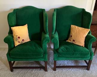 Pair of green velvet wing back chairs by Henredon.
