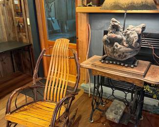 rustic rocking chair is an Adirondack-style piece featuring a natural hickory bentwood frame and slatted oak seating