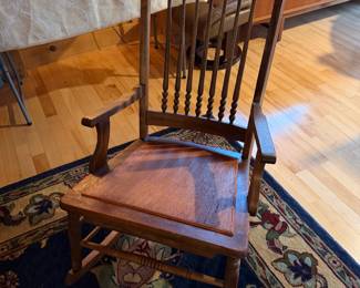 antique wooden rocking chair, likely a platform or patent rocker from the late 1800s