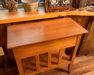 light oak Mission-style table features a single drawer and a lower shelf