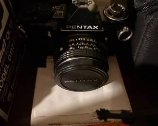 vintage Pentax ME 35mm SLR camera in black features a 50mm lens